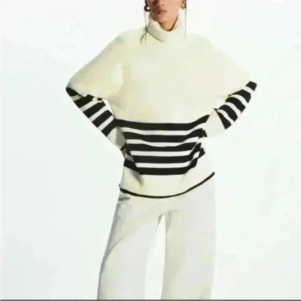 COS Roll neck sweater in white and black striped wool and cotton blend